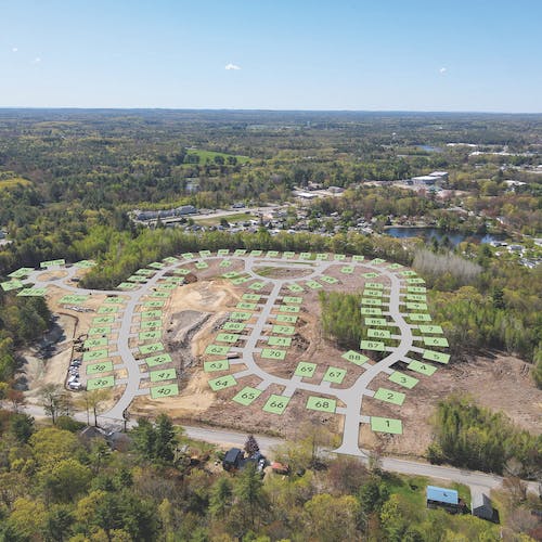 Drone photo of land with plot plan overlay>